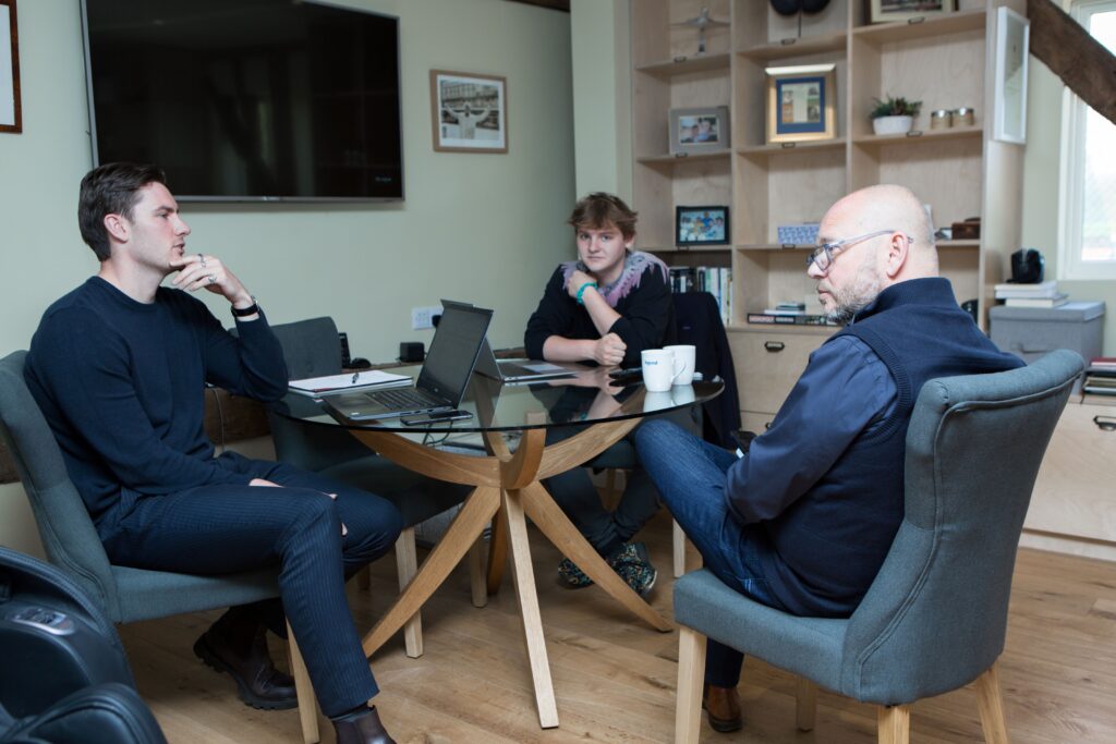 Martley Hall office with CSF Group members having discussion at desk